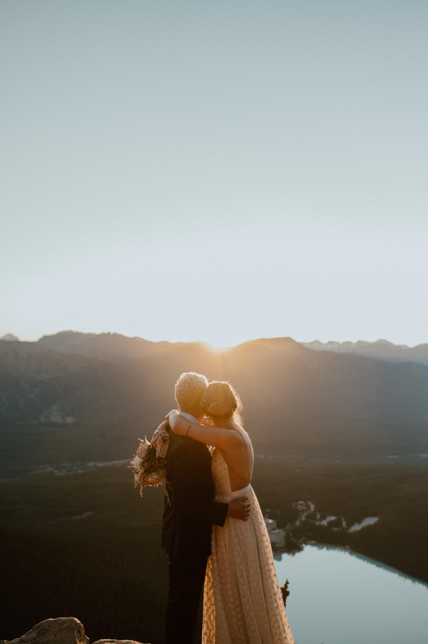 mountain elopement couple at sunrise in banff, alberta