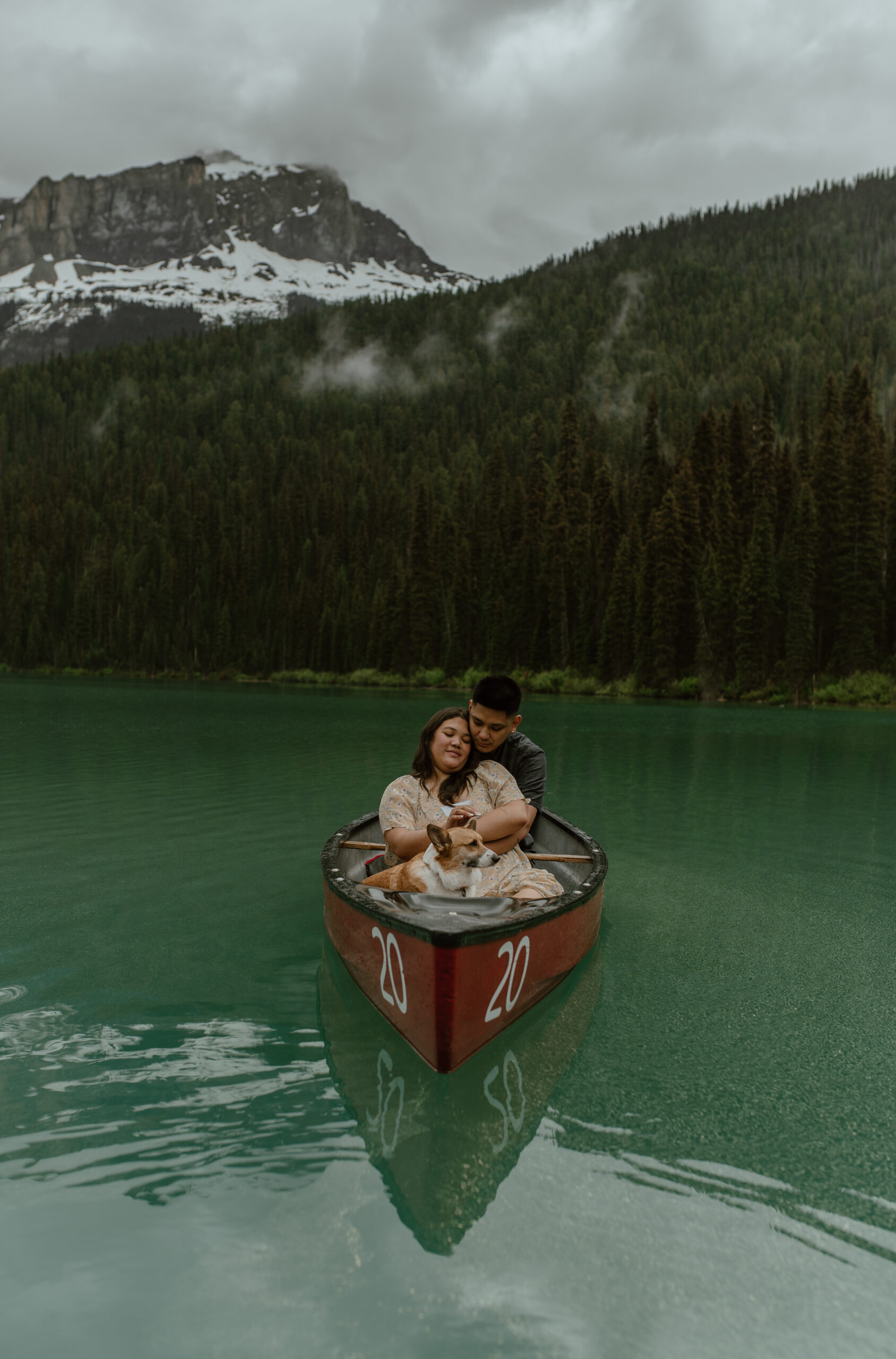 romantic shot of couple in canoe during an adventure engagement session in Banff, Canada