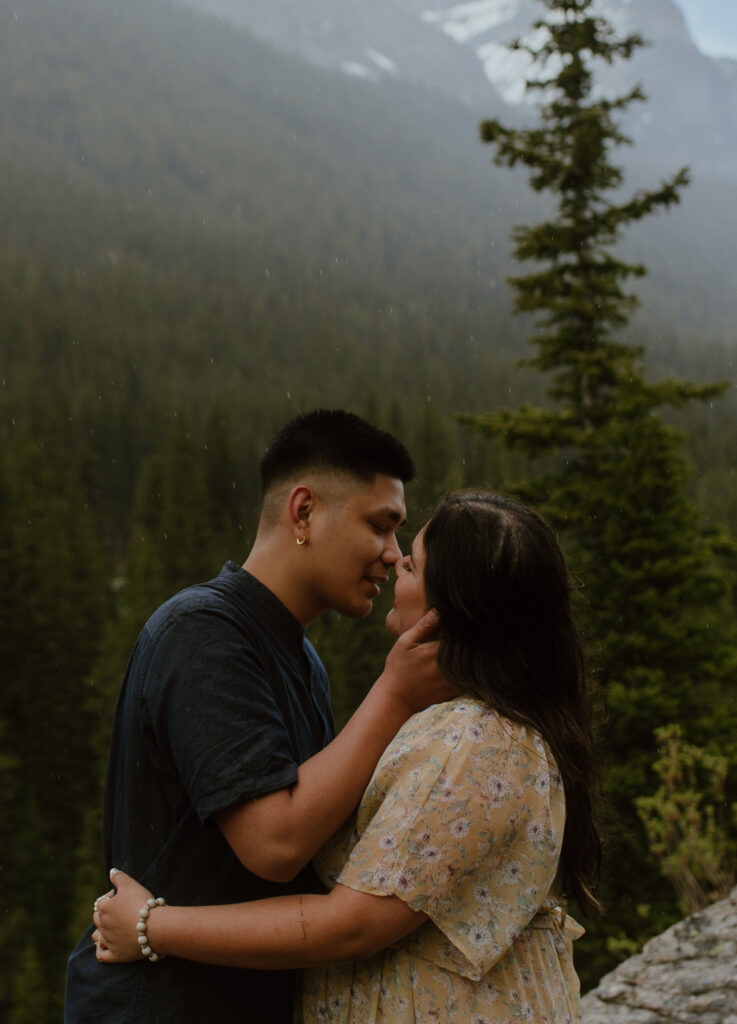rainy engagement photos in the mountains of Banff National Park