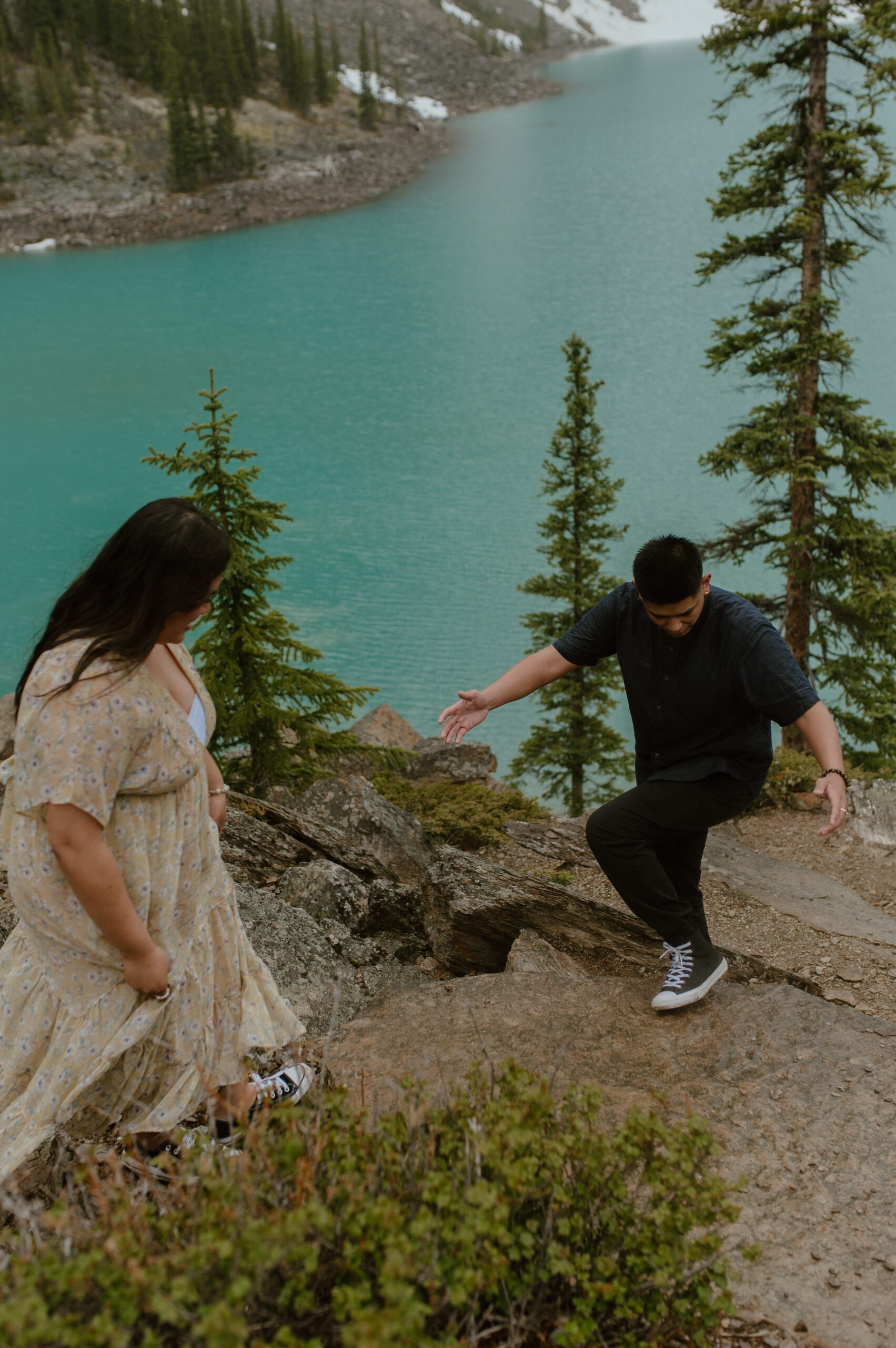 couple hiking at Moraine Lake, Canada