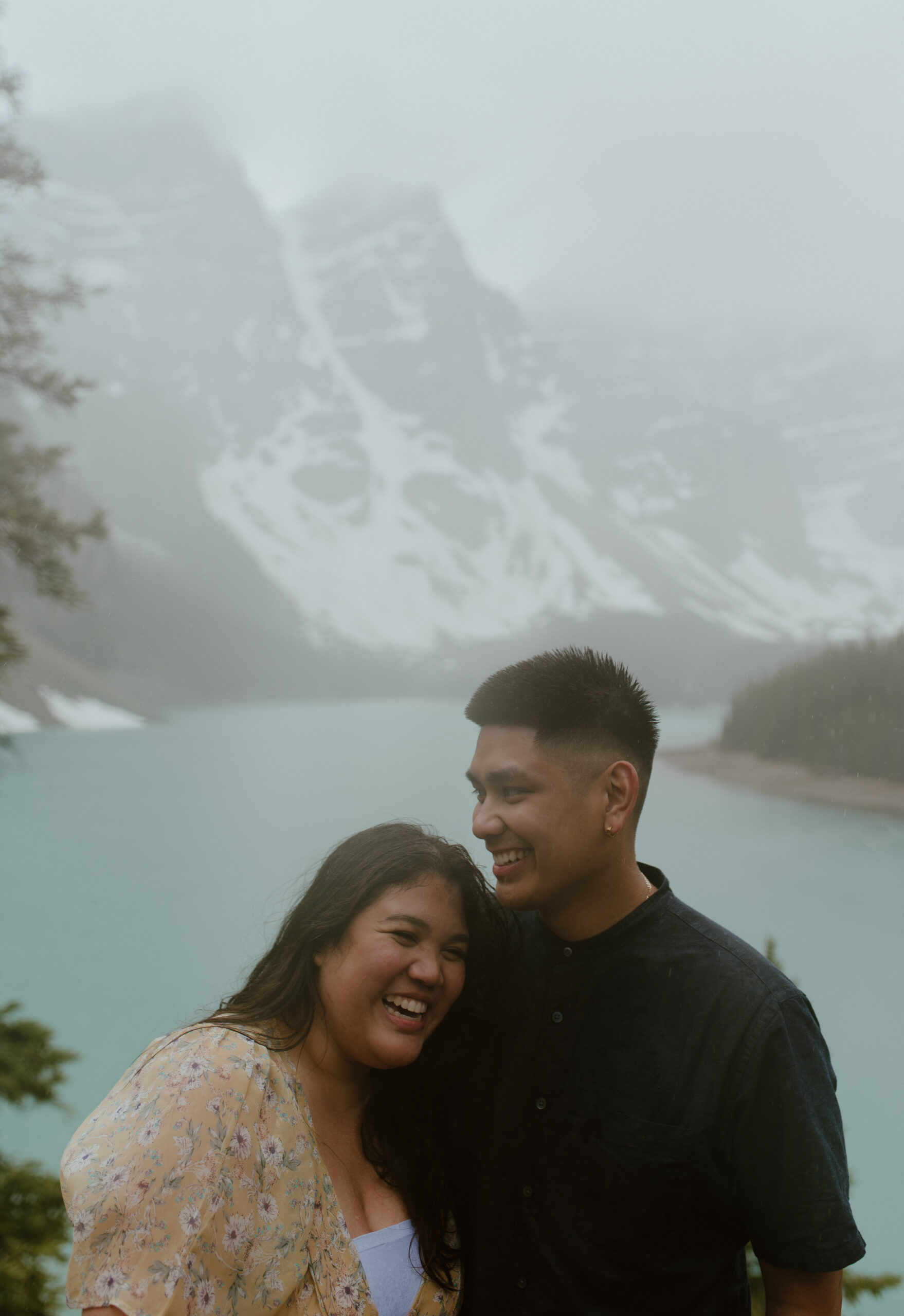 candid couple during engagement session at Moraine Lake, Canada