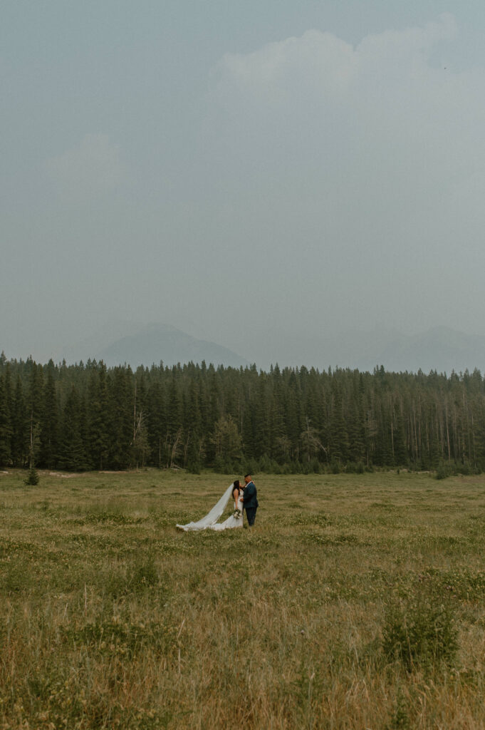 elopement couple during smokey season in the mountains of Jasper National Park