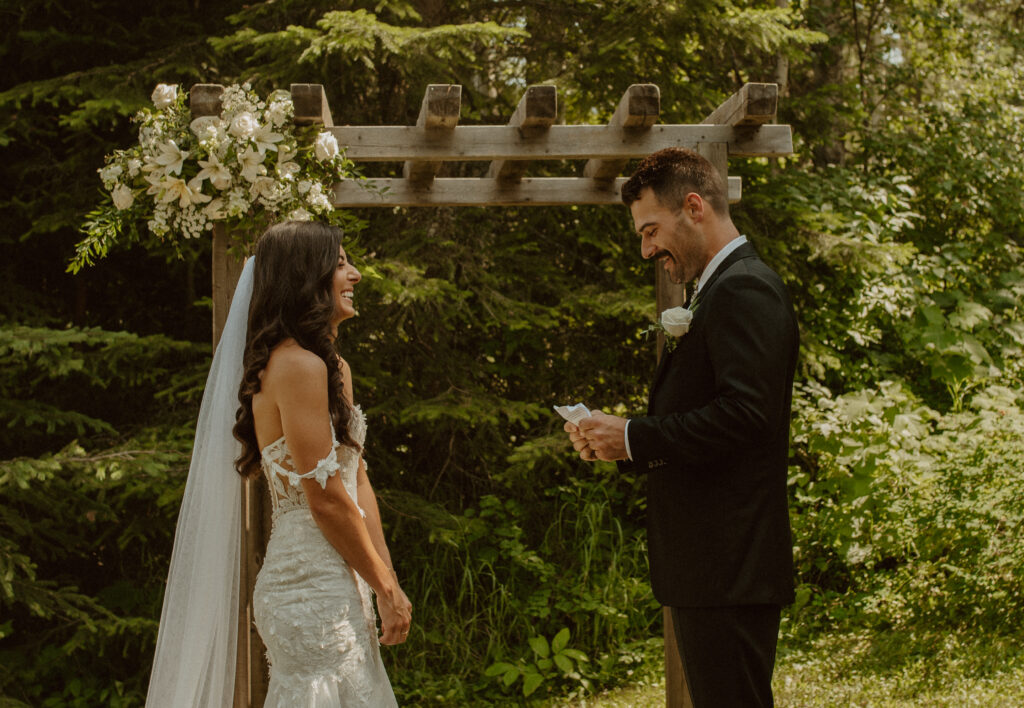 bride and groom saying vows at intimate mountain wedding in BC, Canada
