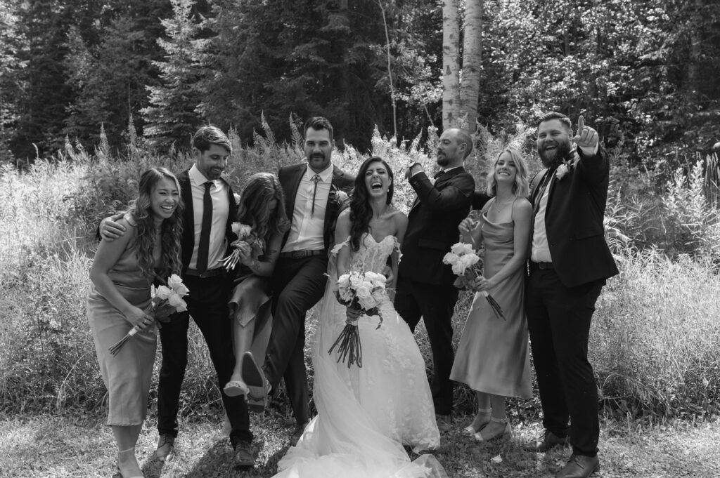 black and white photo of bridal party for intimate summer mountain wedding in Canada