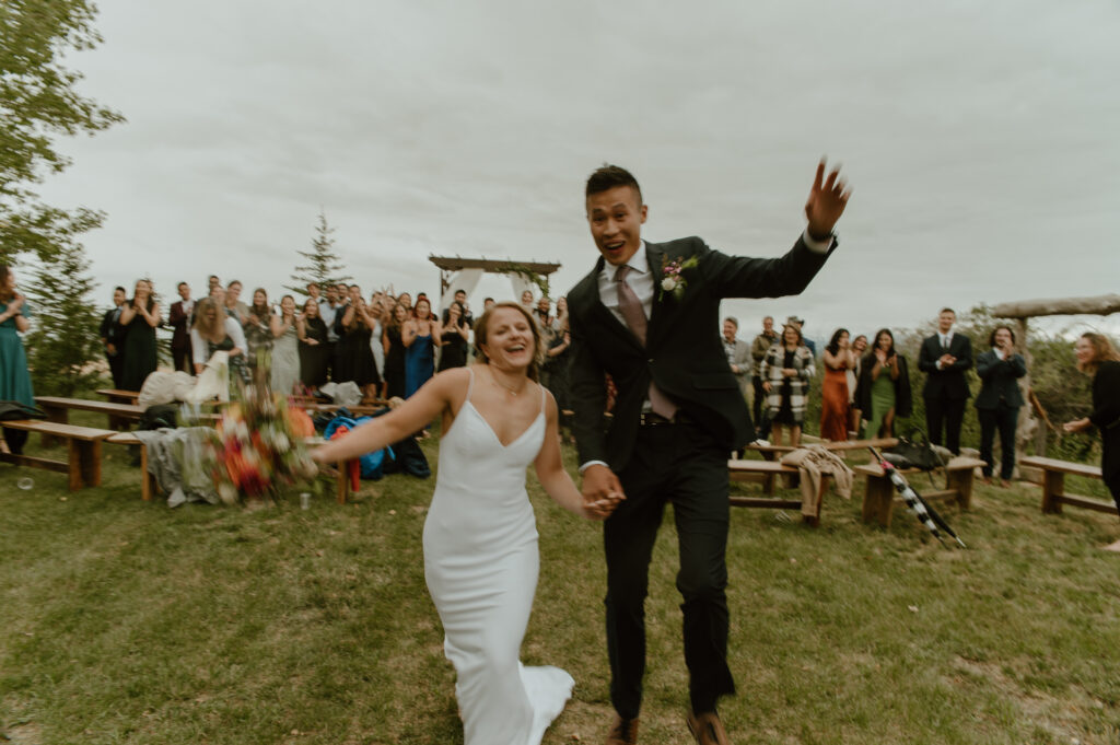 candid shot of couple celebrating wedding in Southern Alberta
