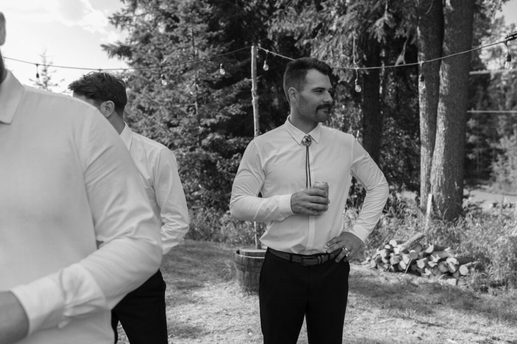 groom gazing at bride during intimate summer mountain wedding in BC, Canada
