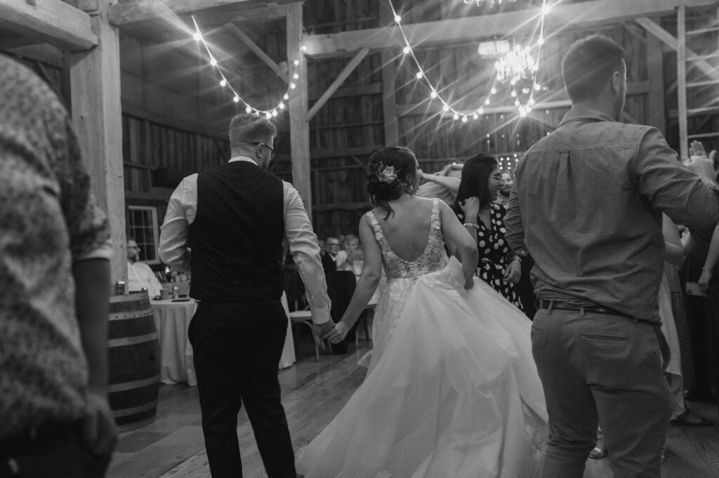 couple shares dance floor with guests during their summer southern ontario wedding