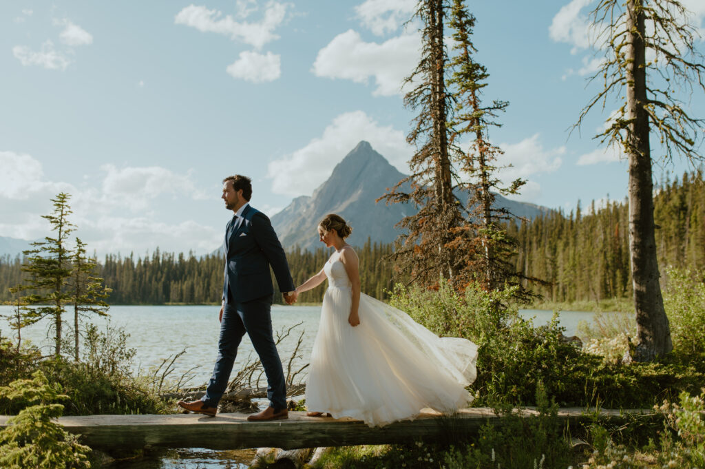 couple exploring the canadian rockies after their elopement ceremony
