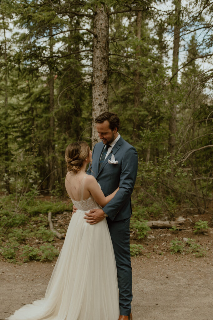 first look before the couple is husband and wife for a Canadian mountain elopement