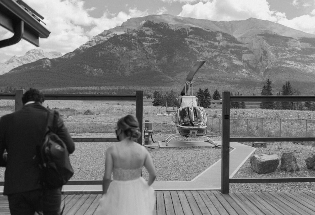 detail shot of couple arriving for their helicopter elopement in Canmore, Canada
